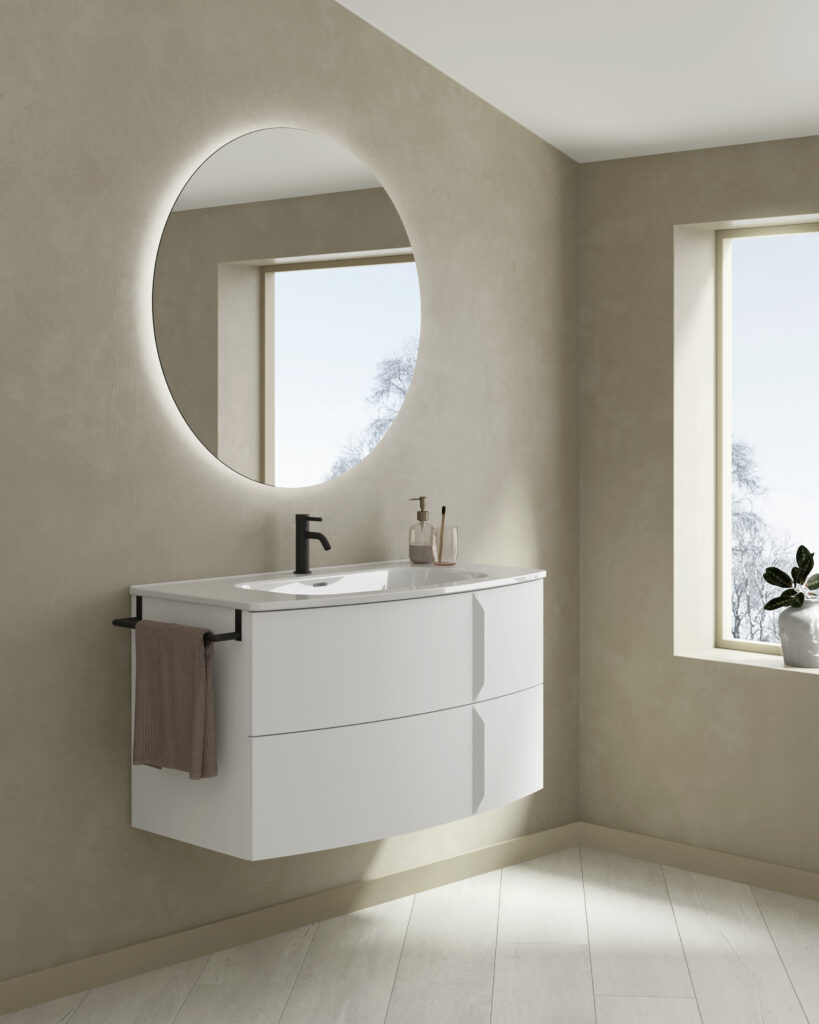 Moble de bany model Wave 100 en blanc mat amb mirall rodó il·luminat, disponible a Euromat Manlleu.